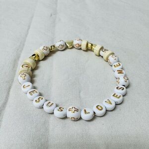 White and Gold Beaded Bracelet with Text Accents